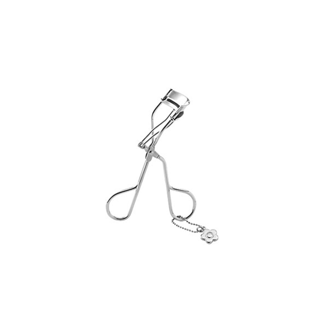 A silver eyelash curler. There is a silver Mary Quant Daisy charm attached.