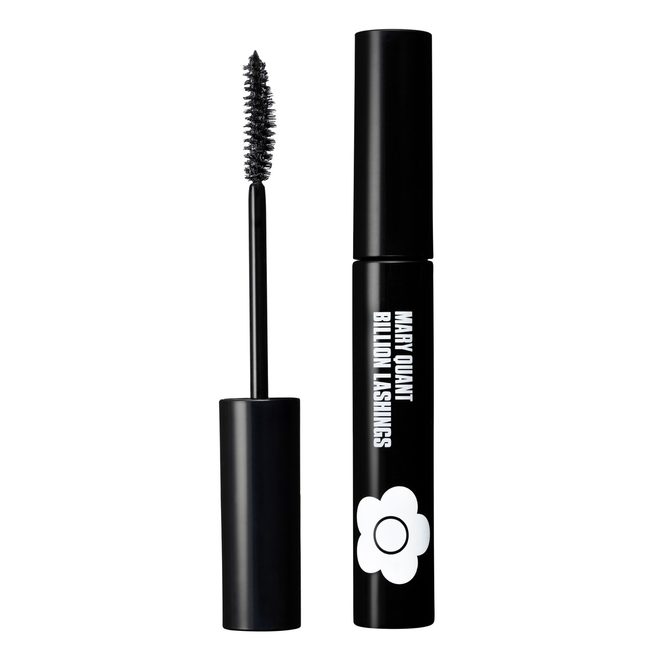 Volumizing mascara with its curved brush adds thickness, curl, length and bold colour. There is a tube of mascara with Mary Quant Billion Lashings and the Mary Quant Daisy printed on the side. Next to the tube is the curved applicator. This shade is EBONY BLACK and is a true black.