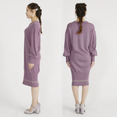 A model shown wearing the Daisy dress, shown from the side and the back. The dress is lilac and has a fluffy Mary Quant Daisy and Mary Quant embroidered on the top. The dress is a coccoon fit and comes to the model's knees.