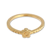 A delicate gold ring with a gold daisy shaped motif at the centre. The ring band has a textured effect.