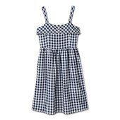 A navy gingham sun dress. The dress is sleeveless and has buttons on the top.