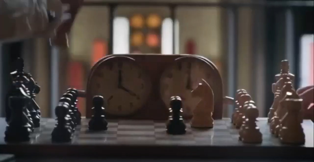 Chessboard with the Queen Gambit Opening and a Clock Showing the Time of  the Game Stock Image - Image of organized, checkered: 235866331