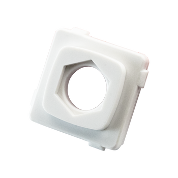 Closeup of white ABS plastic Digitek blank insert showing hexagonal ventilation hole for subtle airflow