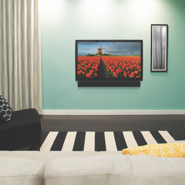 Sanus SA405 soundbar mount attached under wall-mounted TV aligning Sonos soundbar for balanced audio