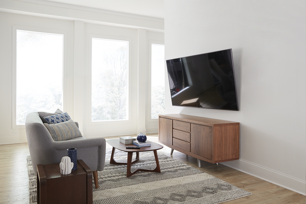 Sanus VLT7 TV wall mount extended 6.8 inches showing 4D tilt and swivel for glare-free viewing