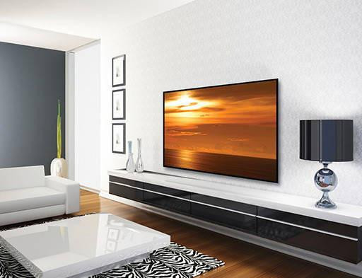 Secura QLL23-B2 low-profile TV wall mount with 65-inch flat-panel hung 1.21 inches from wall for sleek floating display