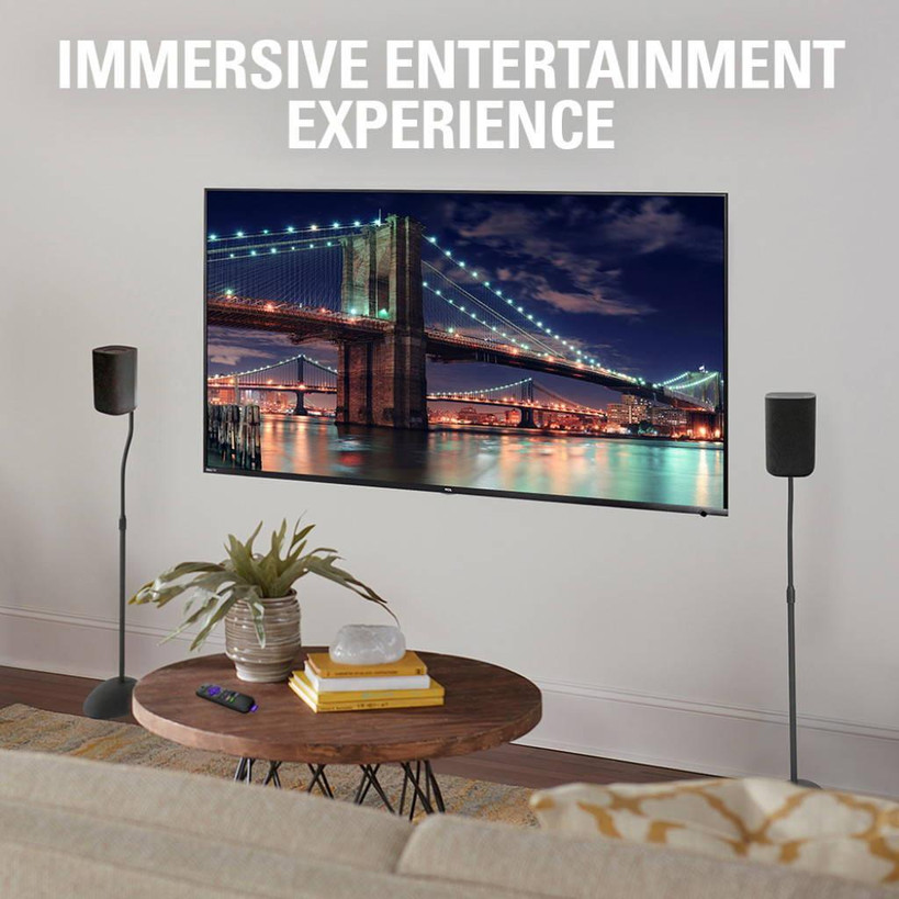 Installed pair of Sanus speaker stands elevating speakers for immersive home theater sound