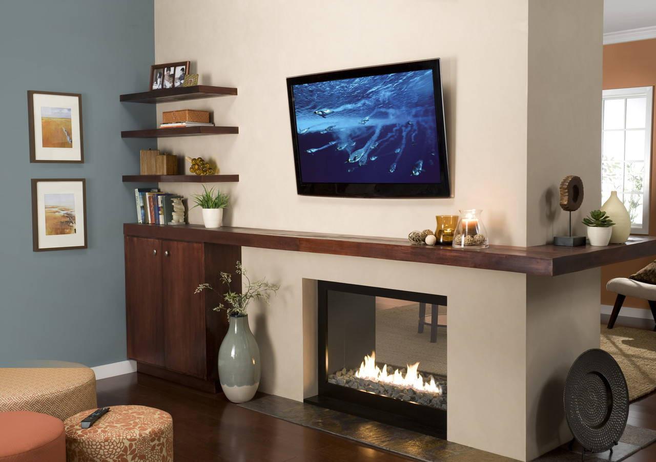 Sanus VMPL50A tilting TV mount with 55-inch LCD adjusted 12 degrees for glare-free living room viewing