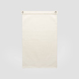 A cream-coloured canvas flag with metal eyelets for hanging. Features a plain design without any text or images.