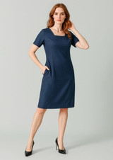 A navy short sleeve dress with a square neckline and pockets, featuring a fitted silhouette. It has a logo.