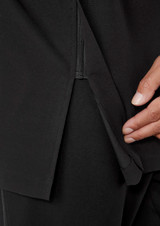 A close-up of a black jacket featuring a zippered opening and a hand demonstrating the detail.