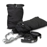 A black outdoor hammock with straps and carabiners, neatly packed in a matching storage bag.