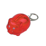 A red piggy bank keyring with a shiny finish, featuring a slot for coins and small eyes.