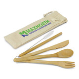 A bamboo cutlery set with a knife, fork, spoon, and straw, packaged in a beige drawstring bag with a logo.