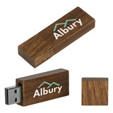 A wooden USB flash drive in brown with a logo on the surface. It features a sliding cap for the USB connector.