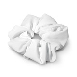 A white hair scrunchie with a textured fabric design, featuring a circular shape and soft pleats.