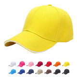 A yellow cotton sandwich cap with a curved brim, featuring a logo, accompanied by various coloured caps beneath it.