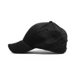 A black cap with a curved brim, featuring a logo on the front and a structured design.