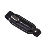 A black leather flash drive holder with a metallic accent and a logo.