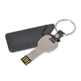 A silver key-shaped flash drive attached to a black leather pouch with a keyring.