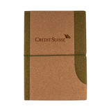 A cork notebook with a green accent and an elastic strap, featuring a logo on the cover.
