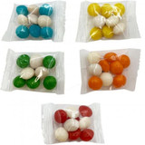 A variety of small, colourful chewy fruit candies in individual plastic wrappers, featuring blue, green, white, yellow, orange, and red.
