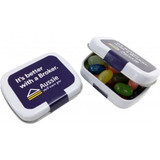 A small rectangle tin filled with colourful Jelly Belly jelly beans, featuring a branded lid.