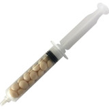 A syringe containing cream-coloured mints, with a clear body and white plunger, featuring a logo on the side.