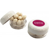 Small transparent screw cap jar containing white mints, with a lid featuring a logo.