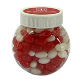 A plastic jar filled with red and white jelly beans, featuring a white lid and branding on top.