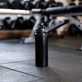 A drink bottle with a sleek black design, featuring a double wall and a secure lid. It has a logo on the side.