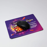 A black mouse rests on a vibrant purple mouse mat featuring a brand logo and chip graphics.