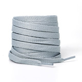 A stack of light grey shoelaces is displayed, featuring a textured, woven design. The image includes a branding logo.