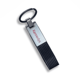 A black PU strap keyring with a metallic silver attachment and a logo.