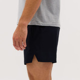 Running shorts in navy blue, featuring a split design and a lightweight fabric. A logo is visible on the shorts.