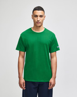A green short sleeve t-shirt featuring a logo on the sleeve, displayed on a model.