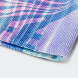 A custom full colour beanie in vibrant shades of pink, blue, and purple with a textured fabric pattern.