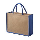 A tote bag featuring a natural jute texture with blue fabric accents and sturdy handles.