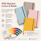 A set of four hardcover notebooks in various colours with matching bands, showcasing a Pantone colour guide.