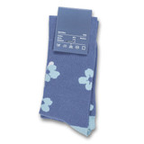 A pair of blue knee-high socks featuring a floral pattern in lighter blue shades, with a tag showing size and material information.