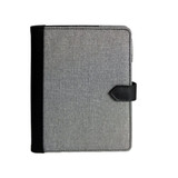 A grey Trekk Journal Book with a black elastic band closure and a textured fabric finish. It features a logo on the cover.