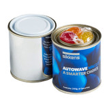 A tin in blue and silver containing colourful boiled lollies, wrapped in clear plastic, with a metal lid.
