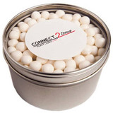 A round silver tin filled with white mints, featuring a branded sticker on the lid.