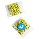 A bag of green wasabi peas, sealed and labelled, featuring a round sticker design, with a mix of green and yellow hues.