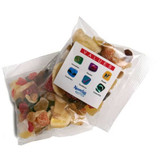 A transparent bag containing a mix of colourful dried fruits, including banana, pineapple, and various chewy fruit pieces.