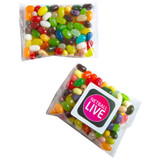 A clear plastic bag filled with assorted colourful jelly beans and featuring a branded sticker.