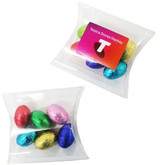 A pillow pack containing six mini solid Easter eggs in various colours: red, blue, green, gold, and silver.