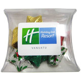 A pillow pack filled with colourful Christmas chocolates in gold, green, red, and silver foil. Includes a logo on the pack.