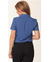 A blue women's short sleeve shirt with a collar, featuring a logo on the back.