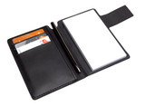 A black leather pocket jotter featuring a notepad, a pen, and spaces for cards.